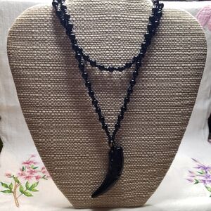 Elegant Black Glass Beaded Necklace with Glass Wolf Tooth Pendant